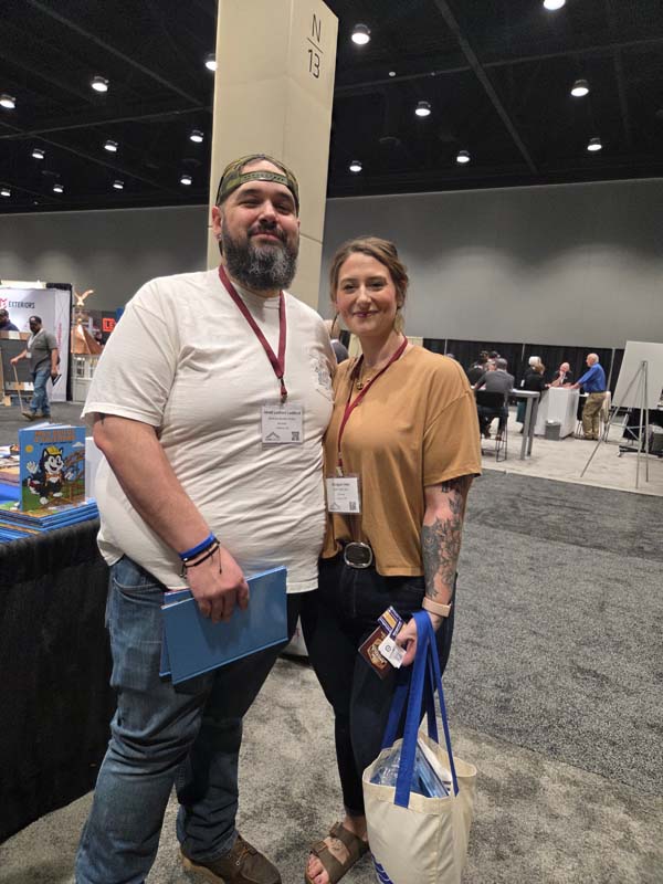 Podcast guru Jared Ledford, left, set up at Frame Building Expo. He will be hosting a series of podcasts about the Post-Frame Builder Show, which takes place in June.