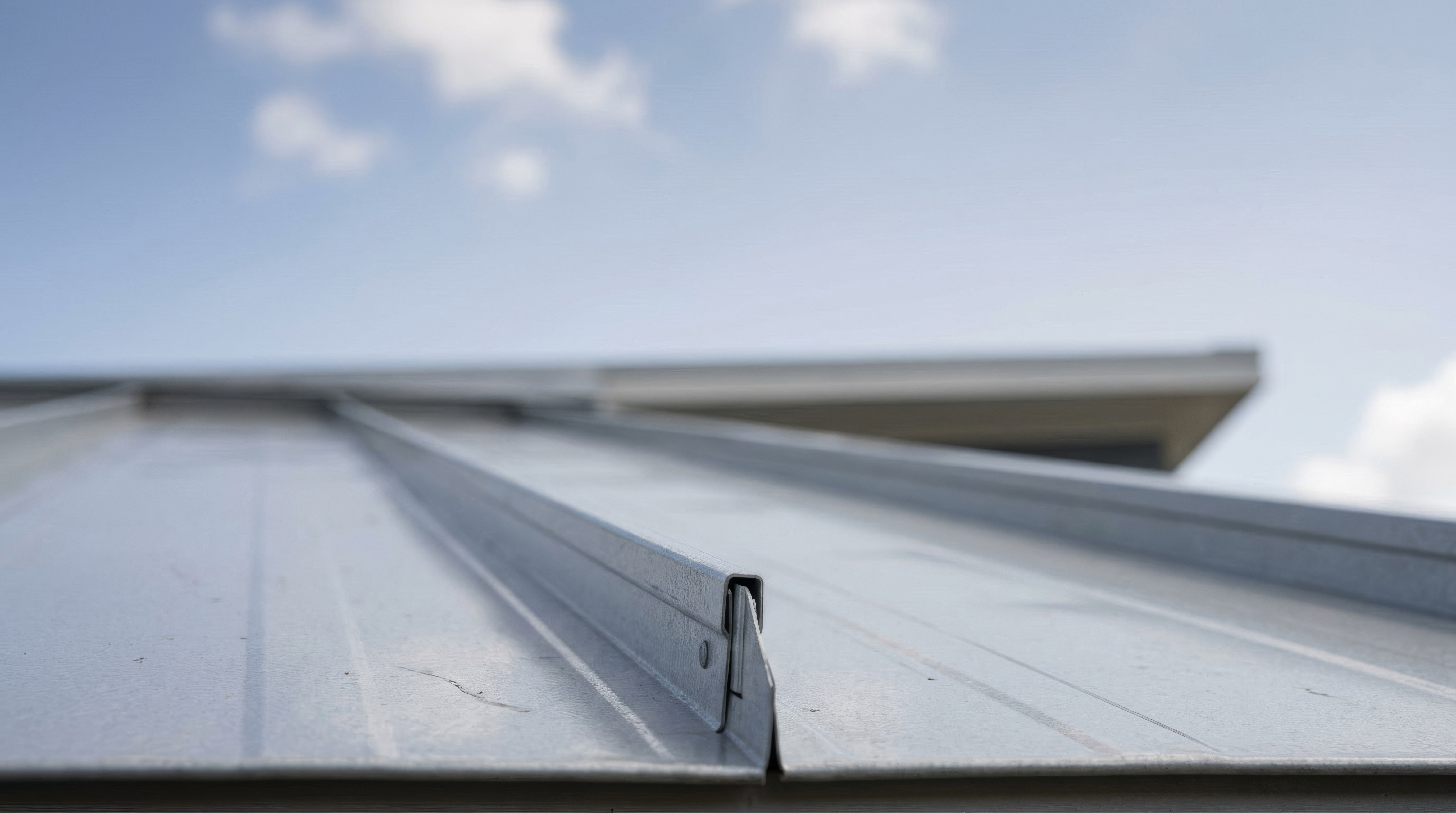 Exposed Fastener vs. Standing Seam Roofing for Post-Frame Homes